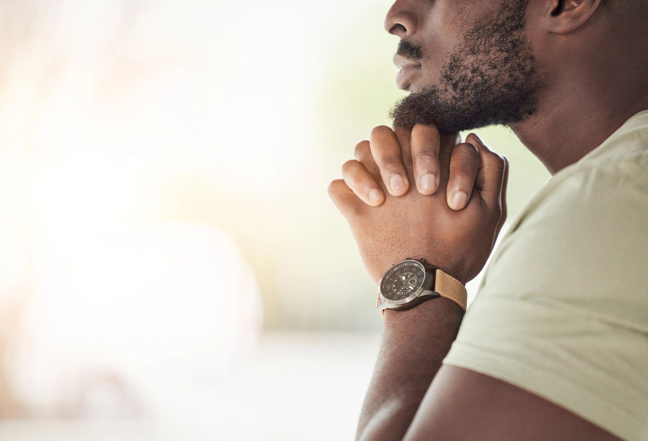Hands folded in prayer at home