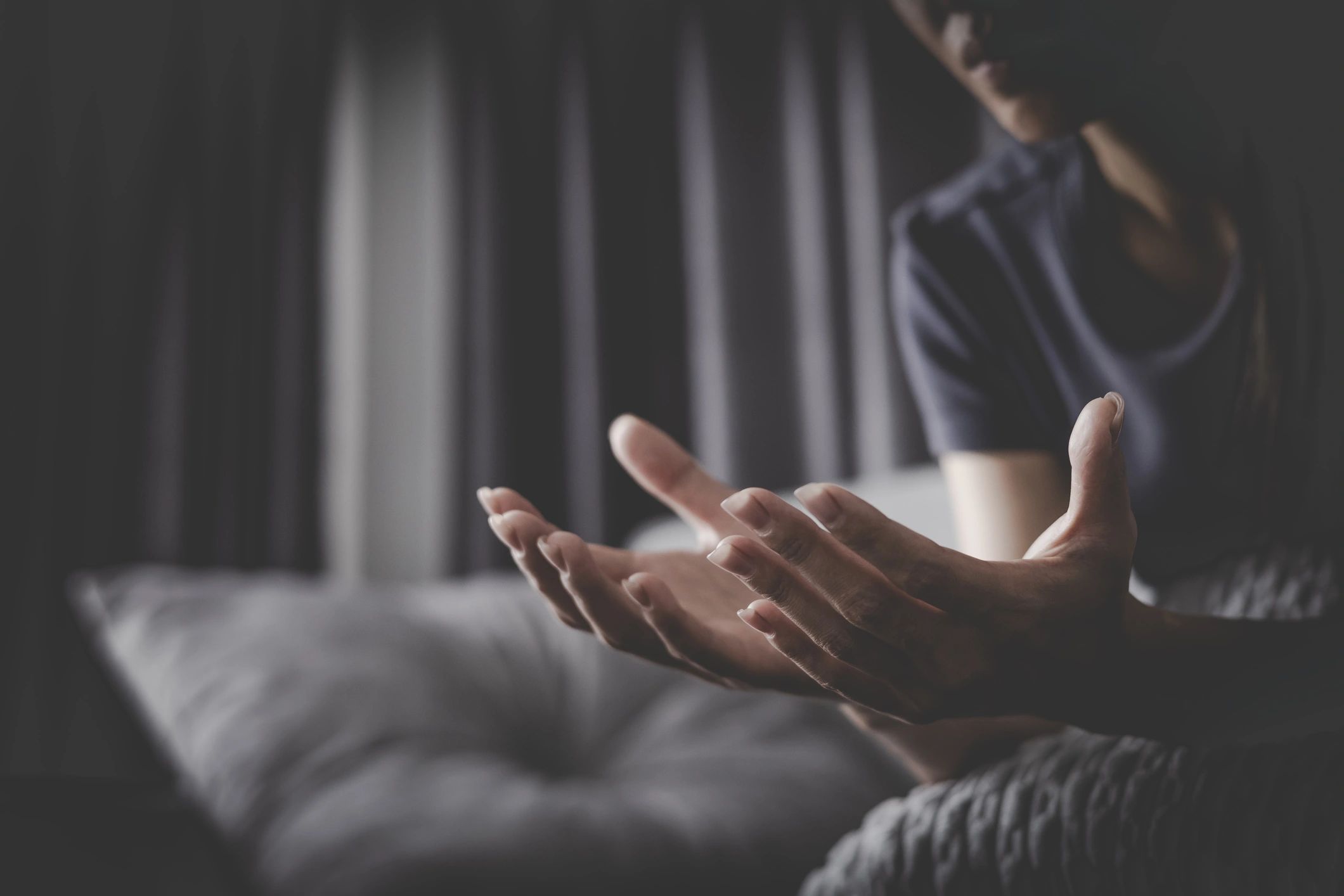 Woman praying in a calm worship setting