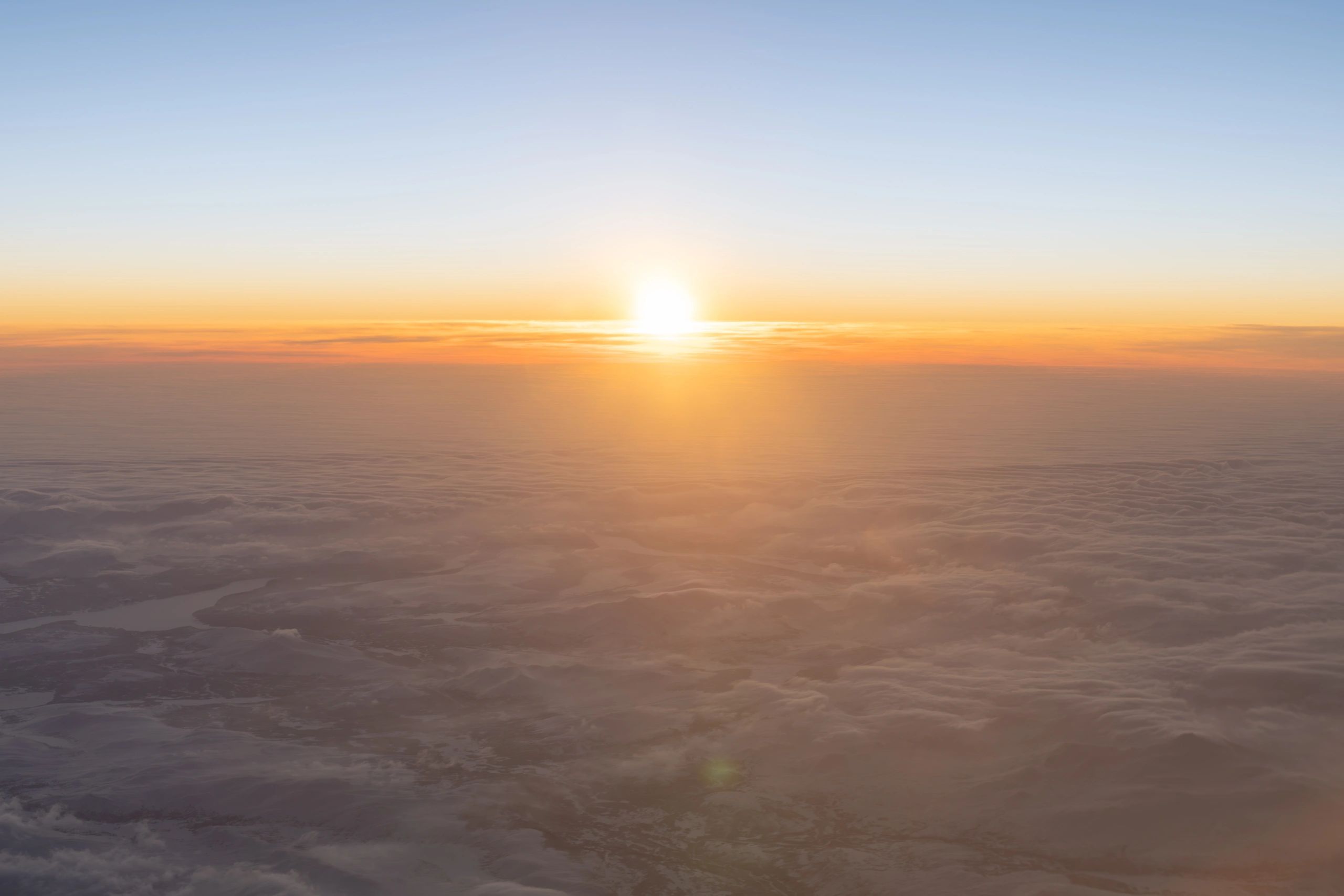 Soft sunrise over the world, representing prayer reaching across nations